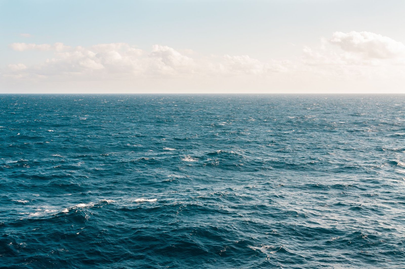 Rugged Cornish coast meeting a slate-blue sea